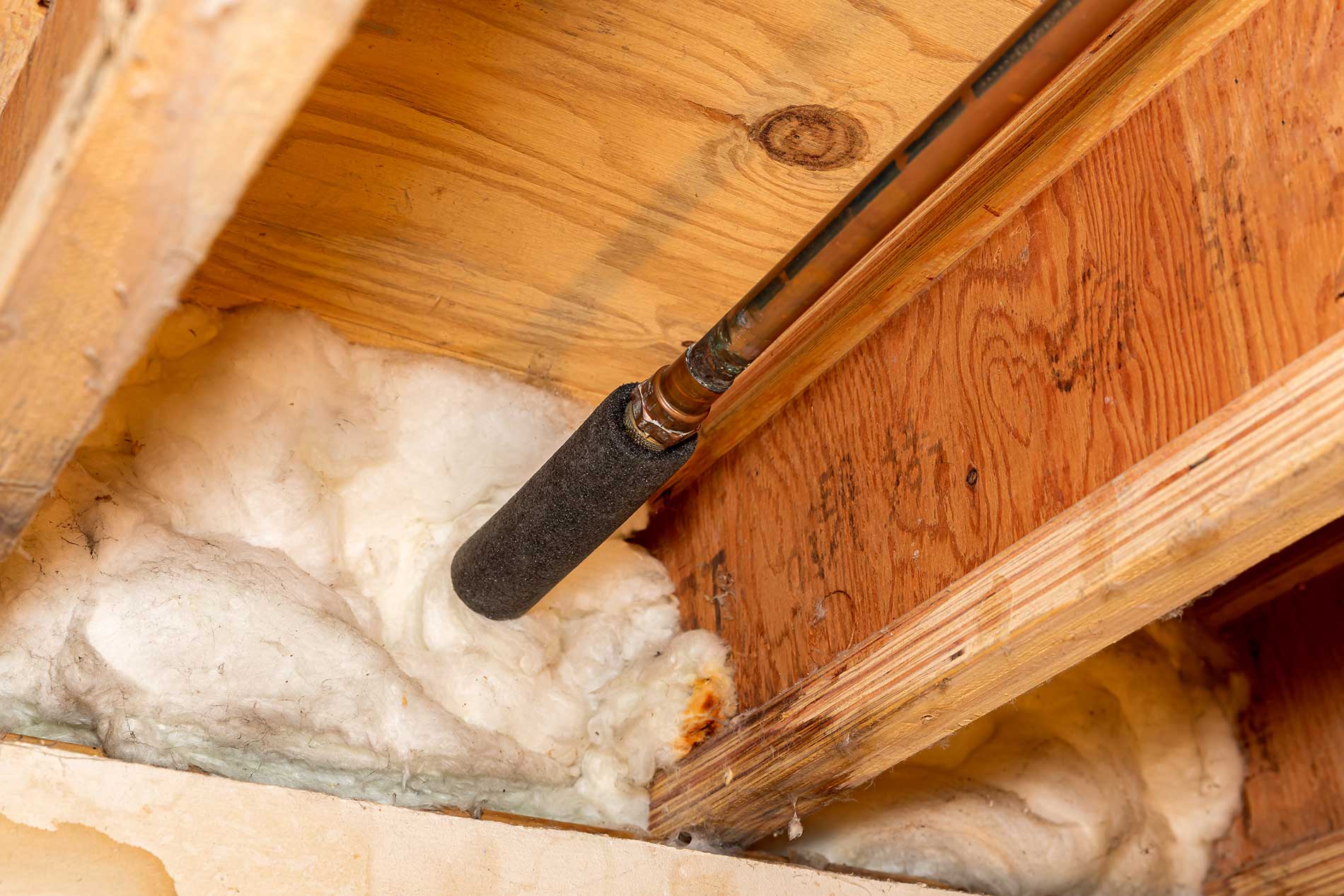 Water-pipe-with-insulation-in-house-crawlspace