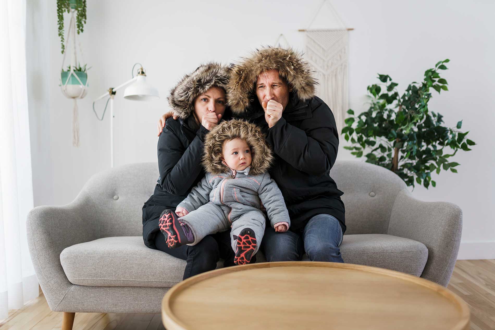 family-indoors-wearing-coats